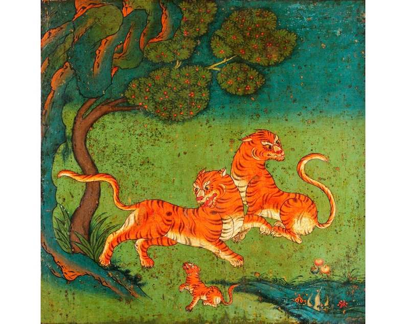 May include: A painting depicting three orange tigers in a green woodland setting. The tigers are shown in a playful pose, with one tiger leaping towards the viewer. The background features a green tree with red berries and a blue sky.