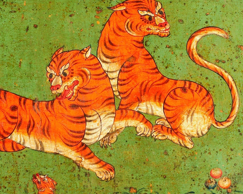 May include: Two orange and black tigers painted on a green background. The tigers are in a dynamic pose, one standing and the other lying down. The painting is done in a traditional style with bold lines and bright colours.