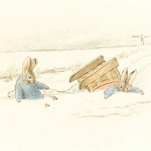 May include: Two brown rabbits are in the snow. One rabbit is sitting in the snow and the other rabbit is lying on its stomach with a wooden sled on top of it.