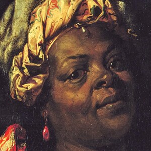May include: A close-up portrait of a woman with dark skin wearing a patterned headscarf and a red and gold garment. She has a serious expression and is wearing a large, red earring.