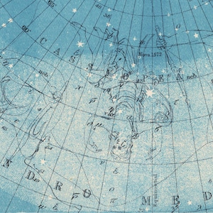 May include: A vintage star chart with a blue background and white grid lines. The chart shows the constellation Cassiopeia, with the text "Nova 1572" and "neb" visible. The constellation Andromeda is also partially visible.