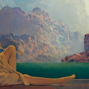 May include: A woman's leg and foot are visible in the foreground, draped in a flowing beige fabric. The background features a scenic landscape with a turquoise body of water and a hazy mountain range in the distance.