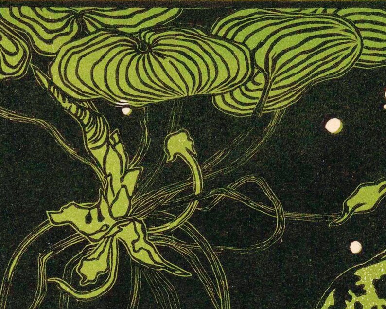 May include: A close-up of a green and black floral design with a stylized flower in the center. The design is reminiscent of Art Nouveau style.