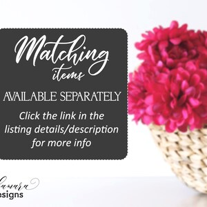 May include: A black and white sign with the text "Matching items AVAILABLE SEPARATELY Click the link in the listing details/description for more info bubamara designs". The sign is in front of a basket of pink flowers.