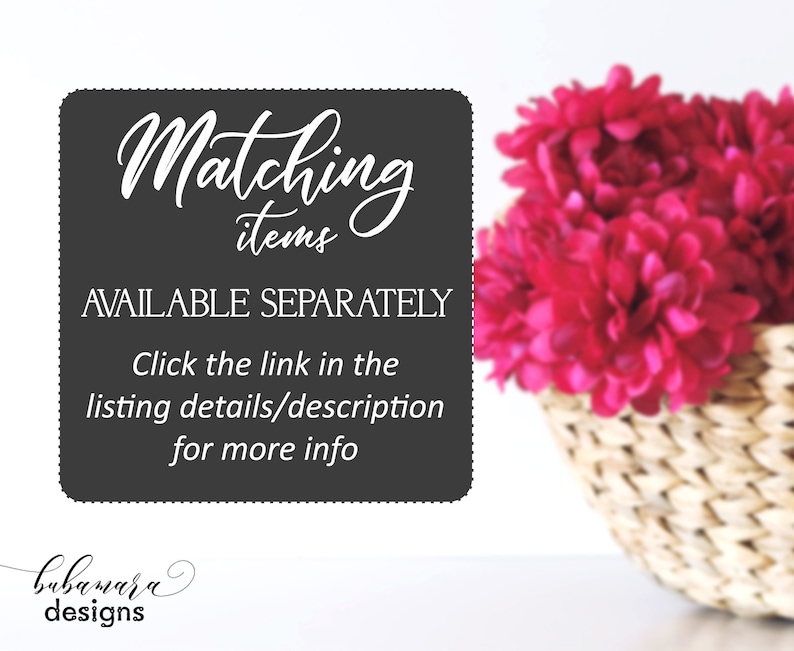 May include: A black and white sign with the text "Matching items AVAILABLE SEPARATELY Click the link in the listing details/description for more info bubamara designs". The sign is in front of a basket of pink flowers.
