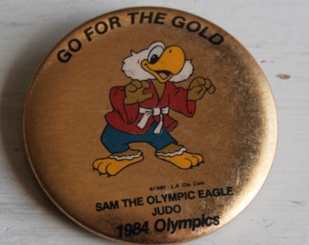 Go For The Gold Sam The Olympic Eagle JUDO Pinback Button Pin L.A. 1984 Olympics