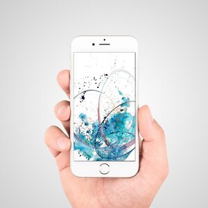 May include: A white smartphone displays an abstract watercolor design in shades of blue, teal, and purple. The artwork features flowing lines and splatters against a white background. The phone is held in a hand.