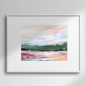 May include: A framed abstract painting of a landscape with a pink, green, and blue color scheme. The painting depicts a distant mountain range with a hazy sky above.