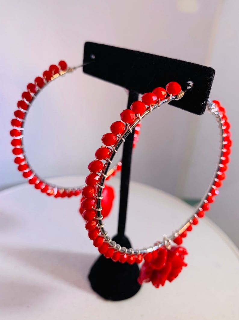 Electric red beads wire wrapped to 2.5 sterling silver lever back hoops with perfectly matched dangling red roses.