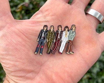 Falling Stones style enamel pin