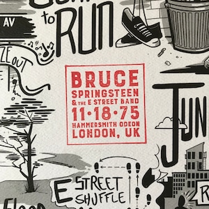 May include: Black and white illustration featuring text and graphics. The central text reads "BRUCE SPRINGSTEEN & THE E STREET BAND 11.18.75 HAMMERSMITH ODEON LONDON, UK". Other elements include a pair of hanging shoes and a street scene.