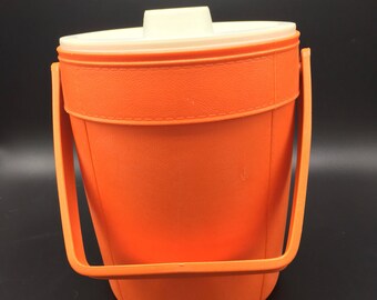 Vintage orange snowflake Rubbermaid plastic ice bucket. Retro, groovy, 1970s