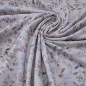 Jersey Organic Cotton Blumen Streublumen lila auf cremeweiß