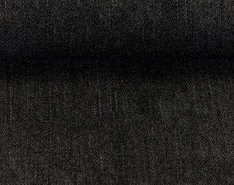 Può includere: Primo piano di un tessuto denim grigio scuro con un sottile motivo testurizzato.