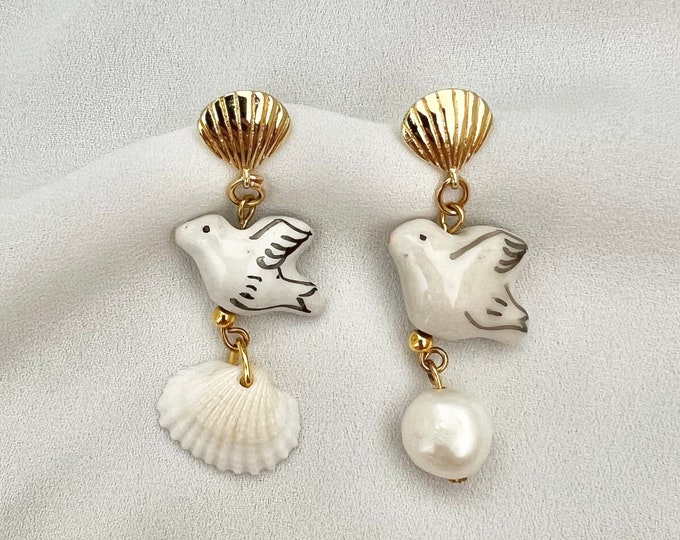 White dove pearl gold shell earrings