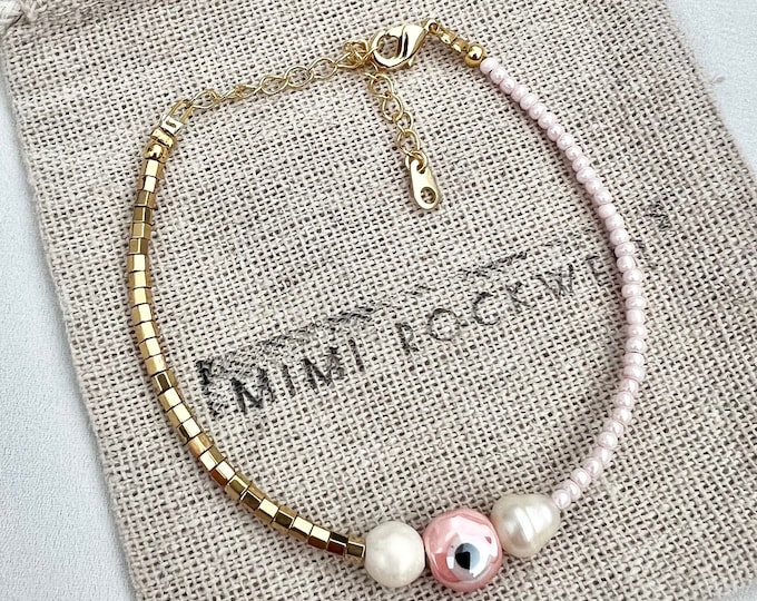 Pink evil eye pearl gold bracelet