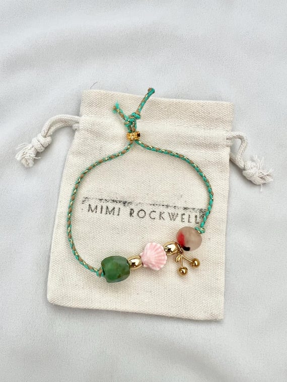 Recycled African glass shell cherry green string gold bracelet