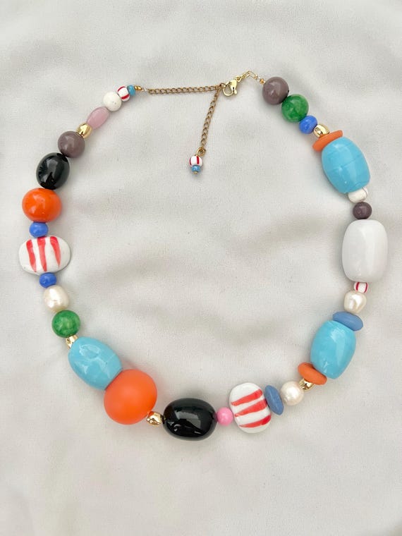 Mix of large beads and pearl multicoloured gold necklace