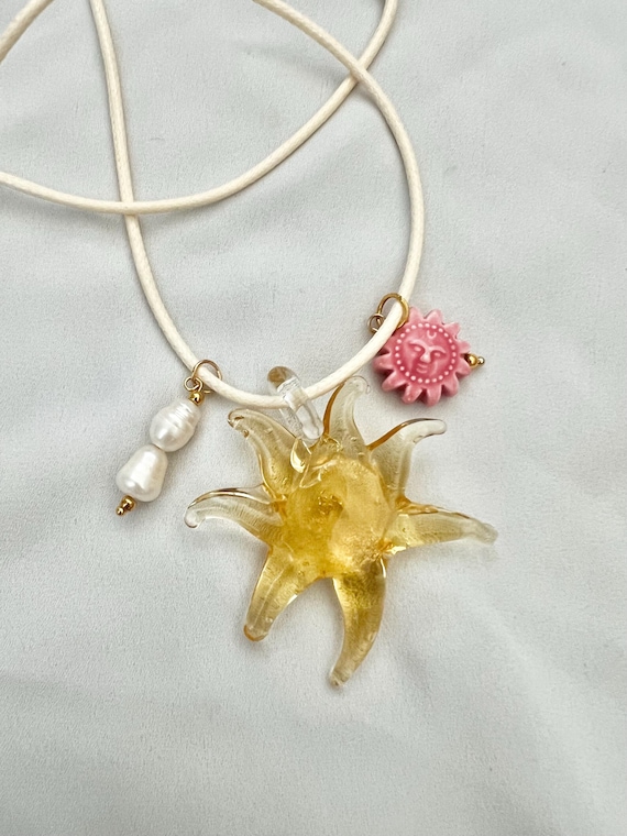 Glass sunflower pink ceramic sun pearl cord necklace