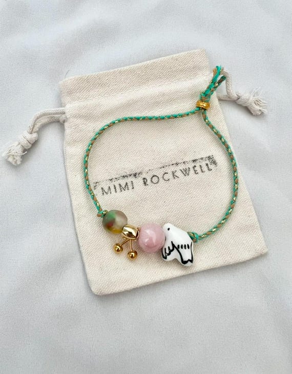 Dove cherry recycled glass shell cherry green string gold bracelet