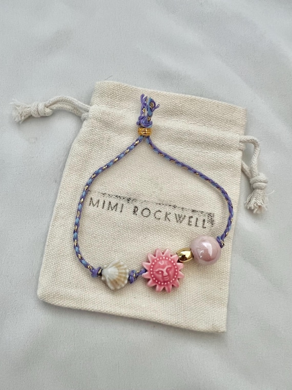 Ceramic pink sun shell blue string bracelet