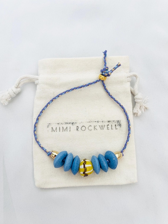 Recycled African glass bead blue gold string gold bracelet