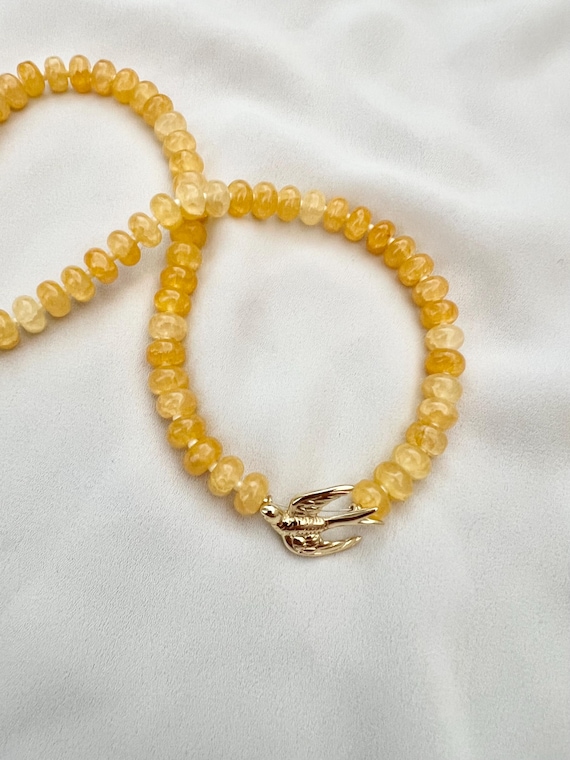 Gold swallow yellow glass bead necklace