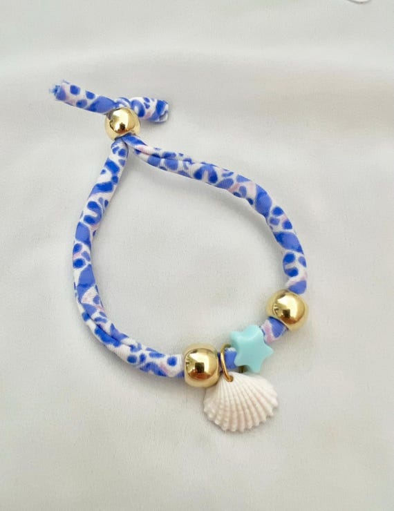Recycled bikini string blue white shell gold string bracelet