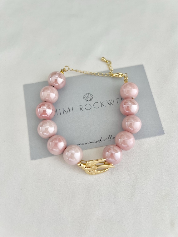 Gold swallow pink ceramic bead bracelet