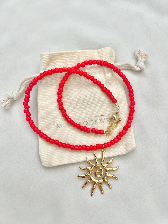 Golden sun pendant red seed bead necklace