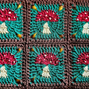 Image shows six crocheted squares with individual toadstool motifs. Toadstools are red and white, with a deep green background and brown border.