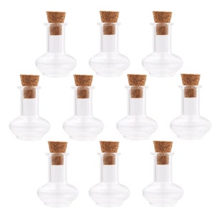 May include: Ten clear glass bottles with cork stoppers. The bottles are round and have a wide base. They are perfect for storing small items, such as essential oils, spices, or craft supplies.