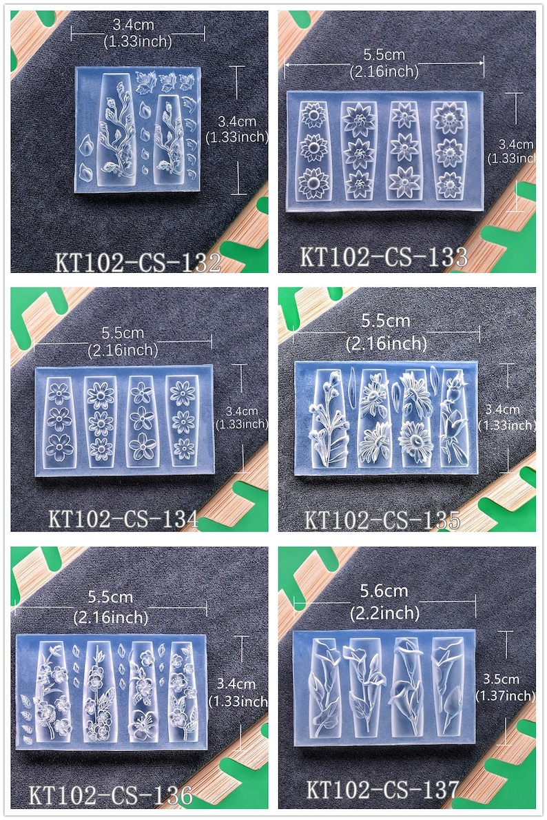 May include: Clear silicone molds for nail art, featuring various floral and botanical designs. Each mold is rectangular, with dimensions of approximately 2.2 inches by 1.37 inches. The image includes the product codes KT102-CS-132 through KT102-CS-137.