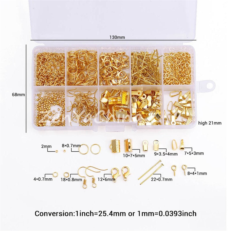 May include: A clear plastic storage box filled with various gold-colored metal jewelry findings. The box is divided into 10 compartments. The findings include jump rings, lobster clasps, earring hooks, beads, and more. The box measures 6.8 inches by 13 inches and is 2.1 inches high. Conversion: 1 inch = 25.4 mm or 1 mm = 0.0393 inch.