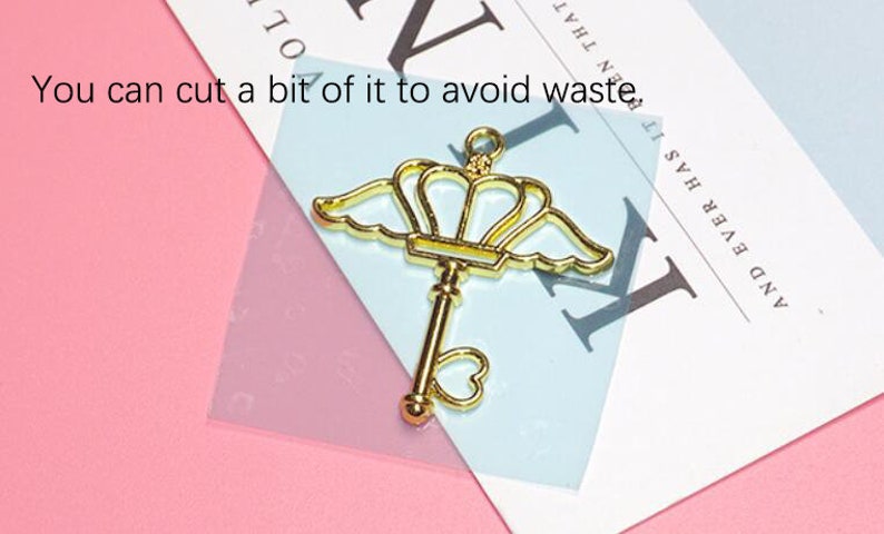 May include: Gold-toned metal key charm with a crown and wings. The key has a heart-shaped hole at the bottom. You can cut a bit of it to avoid waste. AND EVER HAS IT BEN THAT