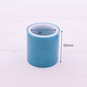 May include: A roll of blue tape with a white core. The tape is 38 inches wide and 50 millimeters tall.