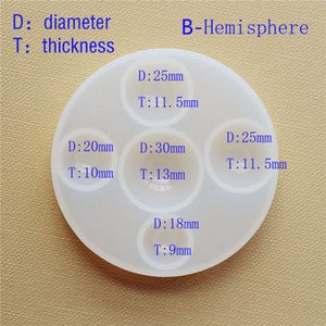 May include: A white silicone mold with five hemispherical cavities for resin casting. The mold has measurements for each cavity, including diameter and thickness in millimeters. The cavities are labeled with the measurements: 25mm, 11.5mm, 25mm, 11.5mm, 20mm, 10mm, 30mm, 13mm, and 18mm, 9mm.