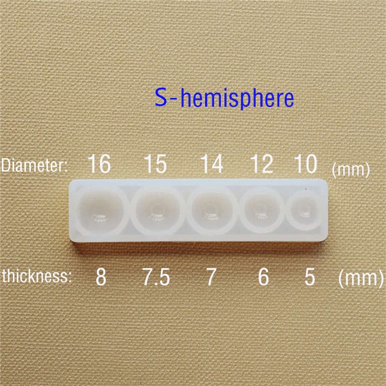 May include: A white silicone mold with six hemispherical cavities of varying sizes. The mold is labeled "S-hemisphere" and includes measurements for diameter and thickness in millimeters. The diameters are 16mm, 15mm, 14mm, 12mm, and 10mm. The thicknesses are 8mm, 7.5mm, 7mm, 6mm, and 5mm.