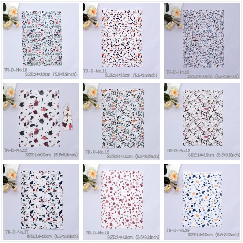 May include: Nine different patterned sheets of faux leather with a terrazzo design. Each sheet is 14 cm by 10 cm. The patterns feature various colours including white, black, grey, pink, red, and blue.