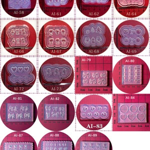 May include: A set of 10 clear silicone molds for crafting. The molds feature various designs, including hearts, bows, butterflies, and animals. The molds are approximately 2 inches wide and 1 inch tall.