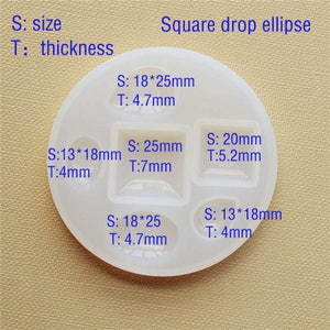 May include: A white silicone mold with six different shapes for resin casting. The mold includes a square, a rectangle, a circle, and three different sized ovals. The mold is labeled with the size and thickness of each shape in millimeters.