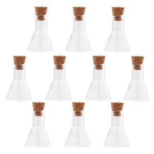 May include: Ten clear glass bottles with cork stoppers. The bottles are conical in shape and have a rounded bottom.