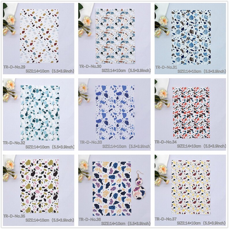 May include: Nine different patterned fabric sheets with a terrazzo design. Each sheet is 14 cm by 10 cm. The patterns feature various colours, including blue, green, red, brown, and white.