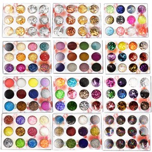 May include: A set of 72 small jars filled with various glitter and iridescent flakes. The jars are arranged in a grid pattern on a white background.