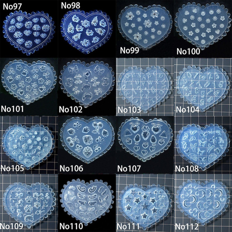 May include: A selection of clear, heart-shaped moulds with scalloped edges. Each mould showcases a unique design, such as flowers, stars, numbers, and other shapes. The moulds are labelled from No97 to No112.
