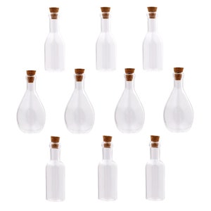 May include: Ten clear glass bottles with cork stoppers. The bottles are various shapes and sizes.