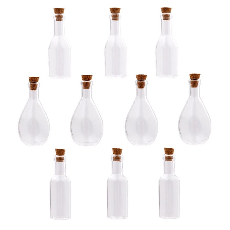 May include: Ten clear glass bottles with cork stoppers. The bottles are various shapes and sizes.