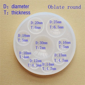 May include: A white silicone mold with eight round cavities of different sizes for making resin crafts. The mold is labeled with the diameter and thickness of each cavity in millimeters. D: diameter, T: thickness.