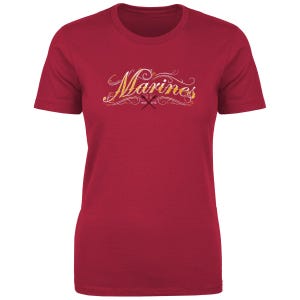 May include: A red t-shirt with a white graphic of the word "Marines" in a stylized font with a gold outline. The graphic also includes a small cross with the text "Est. 1775".