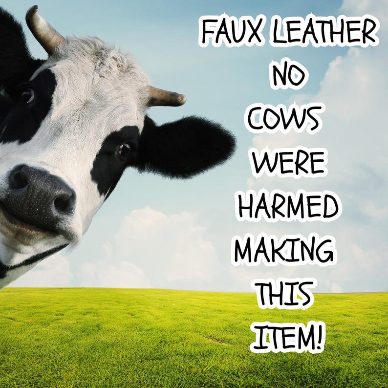 May include: A black and white cow head is positioned on the left side of the image against a green field and blue sky. The text FAUX LEATHER NO COWS WERE HARMED MAKING THIS ITEM! is written in white capital letters with a black outline on the right.